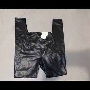 Black faux leather cross over leggings